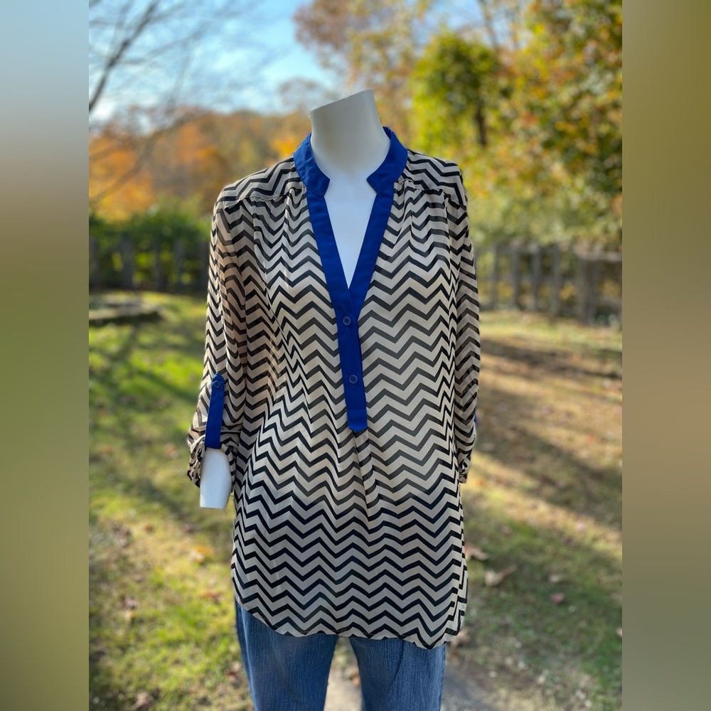 Tacera size medium women’s sheer tan/black/royal blue chevron top.